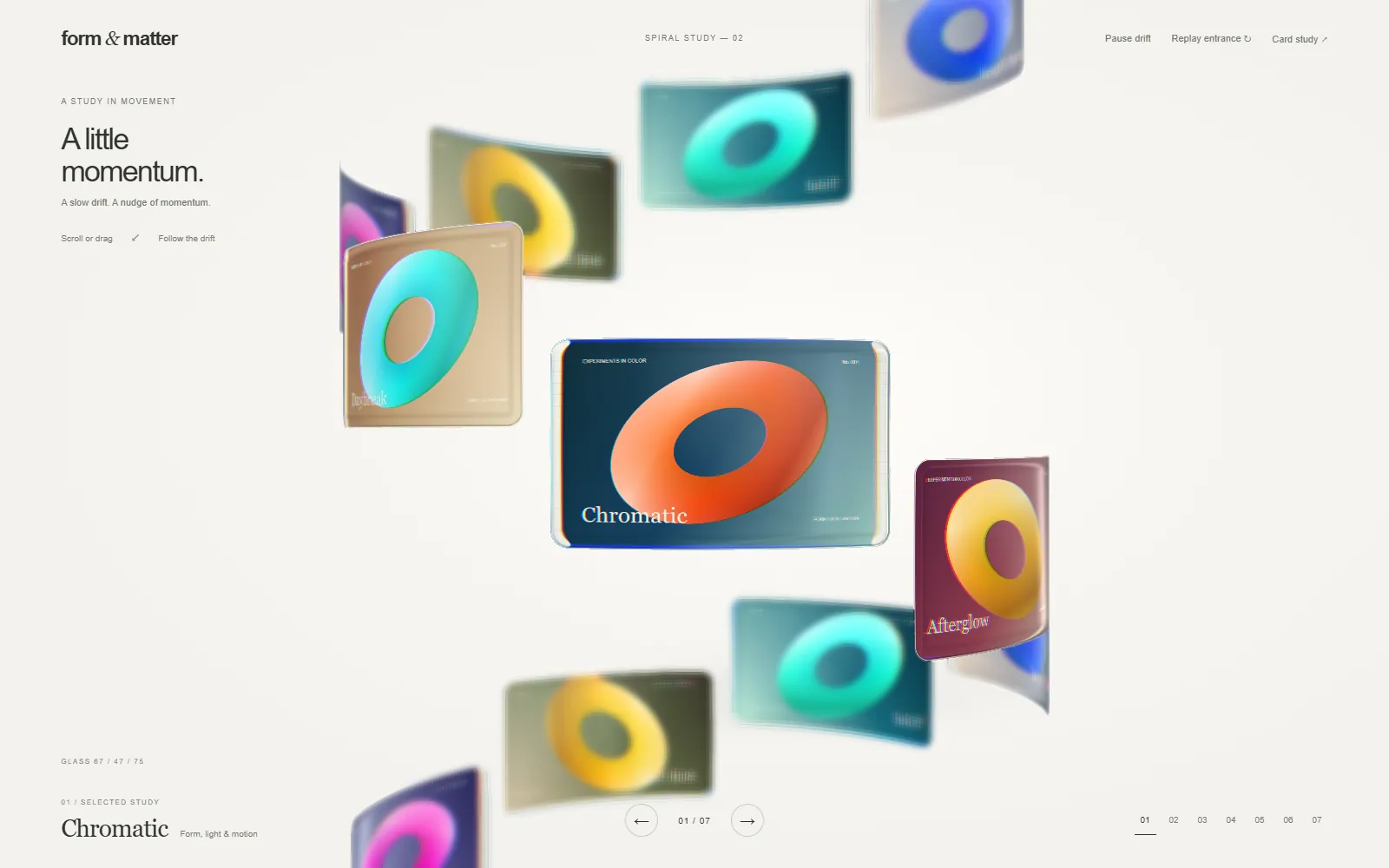 Light-grey study page with glass cards arranged on a spiral, the front card showing an orange ring